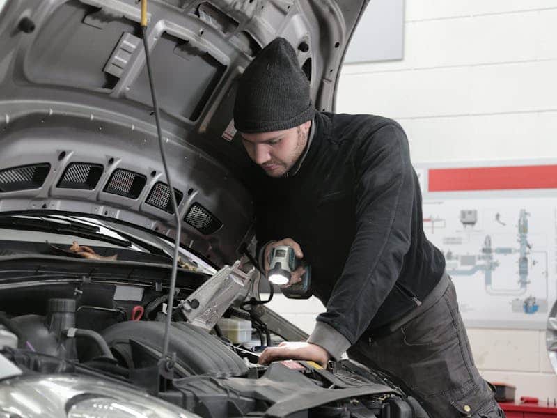 Mechanic working on vehicle